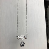 Elegante Edelstahl-Halskette mit zarten Hundepfoten